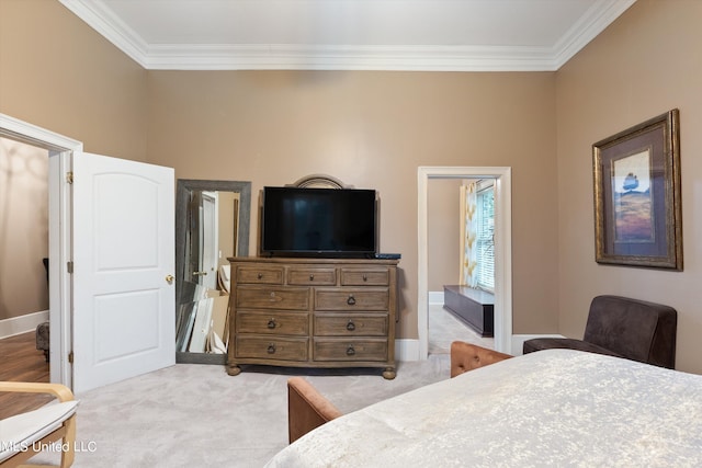 carpeted bedroom featuring crown molding