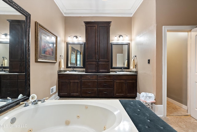 bathroom with vanity, ornamental molding, and a bath