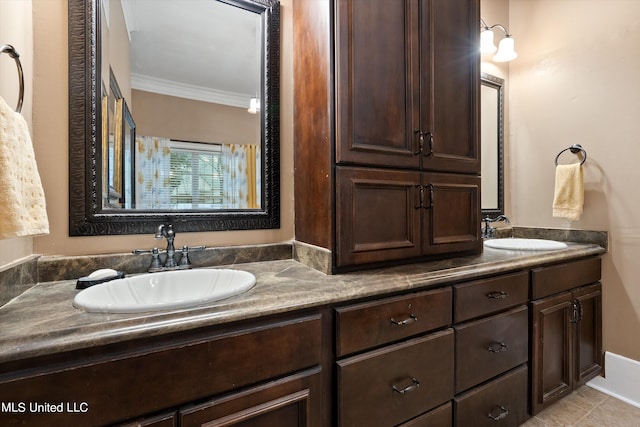 bathroom featuring vanity, crown molding, and tile patterned flooring