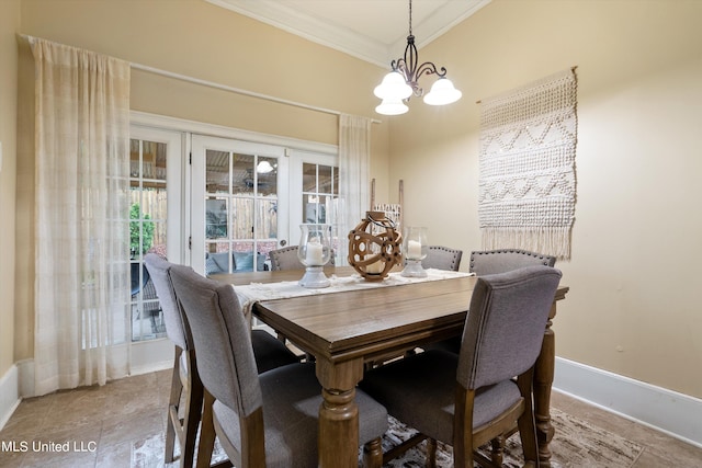 dining room with crown molding and an inviting chandelier