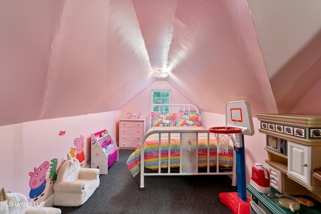 bedroom with lofted ceiling and dark carpet