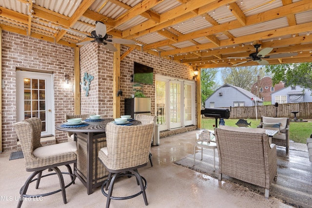 view of patio / terrace featuring french doors and ceiling fan