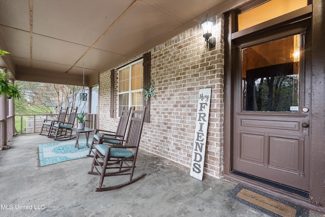 doorway to property featuring covered porch