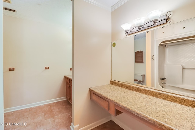 full bathroom featuring tile patterned floors, toilet, tub / shower combination, ornamental molding, and vanity