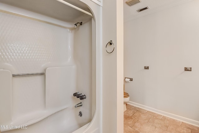 bathroom with toilet and  shower combination