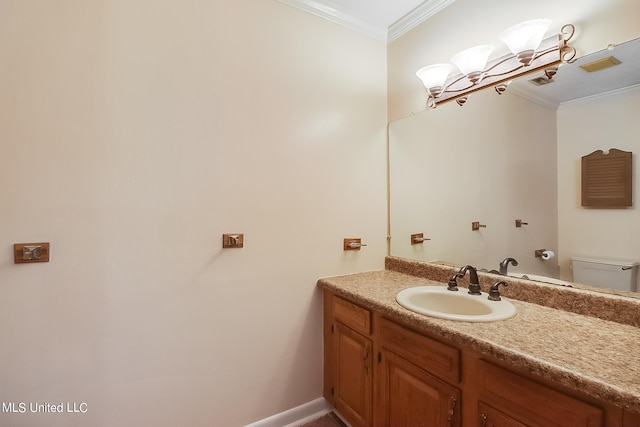 bathroom featuring vanity, toilet, and crown molding