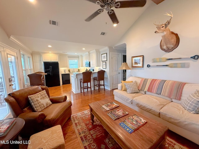 2997 Deerfield Rd, Yazoo City, MS 39194 - living room featuring light wood-style flooring, a ceiling fan, lofted ceiling, recessed lighting, and crown molding