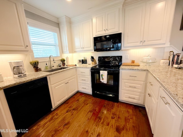 2997 Deerfield Rd, Yazoo City, MS 39194 - kitchen featuring black appliances, a sink, white cabinetry, ornamental molding, and dark wood-type flooring