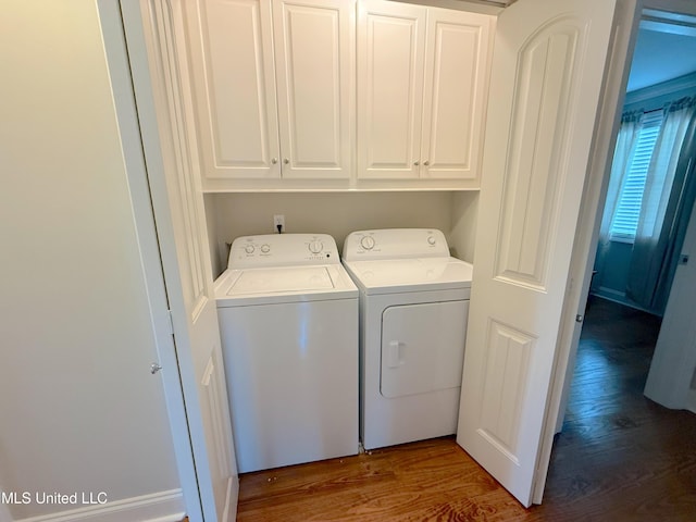2997 Deerfield Rd, Yazoo City, MS 39194 - laundry area with independent washer and dryer, wood finished floors, and cabinet space