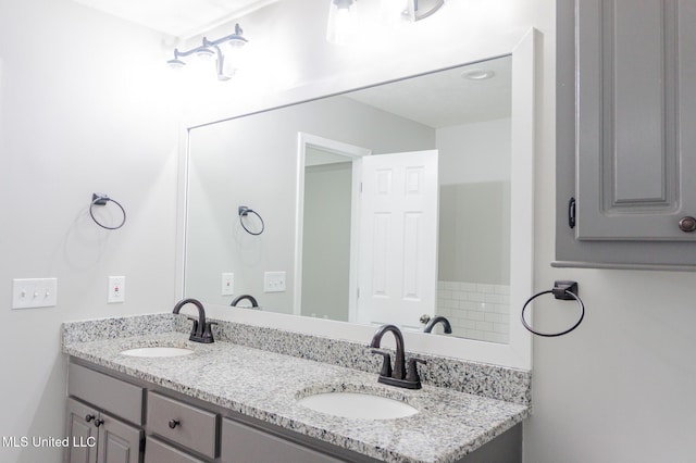 bathroom with double vanity