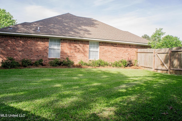 view of side of property featuring brick siding and roof with shingles