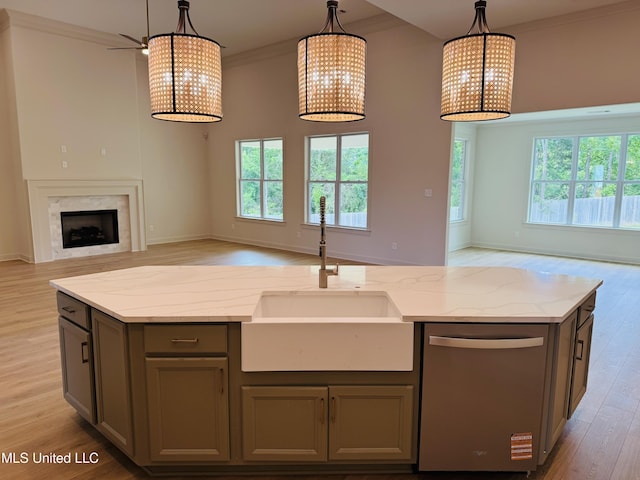 9549 Mcelroy Farms Dr, Olive Branch, MS 38654 - kitchen featuring open floor plan, stainless steel dishwasher, a sink, an island with sink, and crown molding