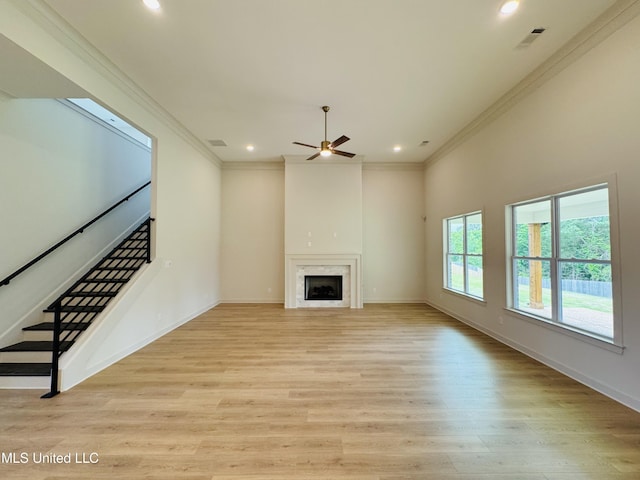 9549 Mcelroy Farms Dr, Olive Branch, MS 38654 - unfurnished living room featuring ornamental molding, recessed lighting, ceiling fan, light wood finished floors, and stairway