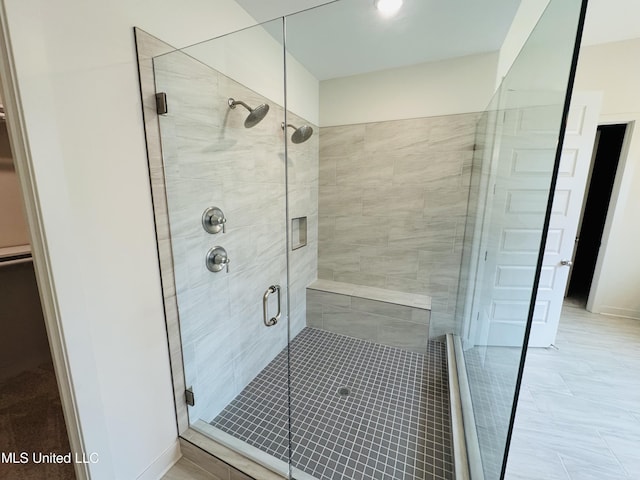 9549 Mcelroy Farms Dr, Olive Branch, MS 38654 - full bath featuring a shower stall, a walk in closet, and baseboards