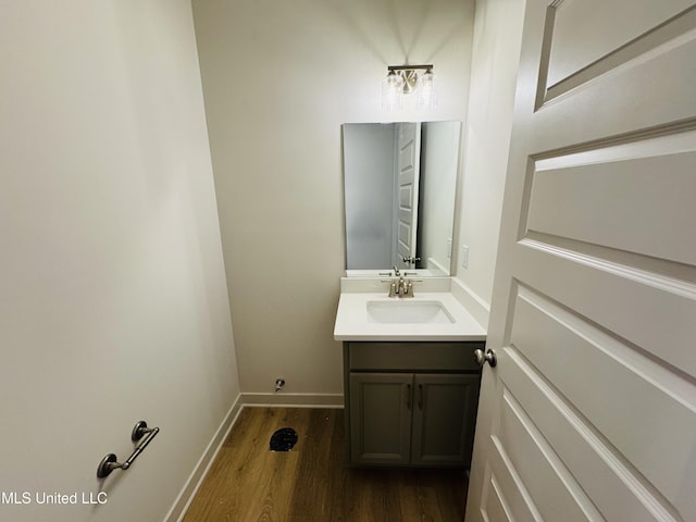 9549 Mcelroy Farms Dr, Olive Branch, MS 38654 - bathroom featuring vanity, wood finished floors, and baseboards