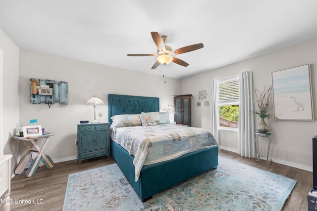 13400 Willow Oak Cir, Gulfport, MS 39503 - bedroom featuring wood finished floors, baseboards, and ceiling fan