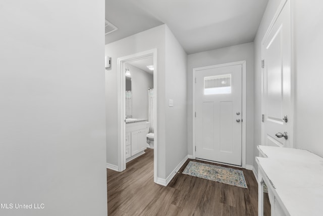 13400 Willow Oak Cir, Gulfport, MS 39503 - foyer with baseboards and dark wood finished floors