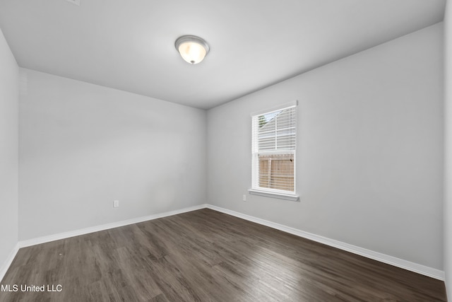 13400 Willow Oak Cir, Gulfport, MS 39503 - empty room with dark wood finished floors and baseboards