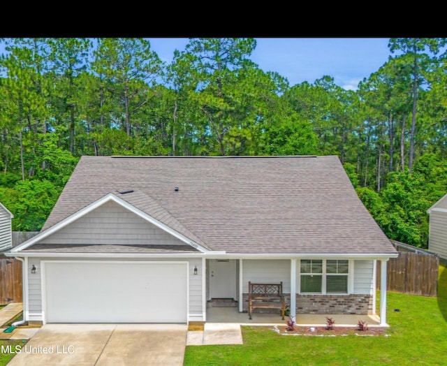 13400 Willow Oak Cir, Gulfport, MS 39503 - view of front of house with covered porch, a garage, driveway, and roof with shingles