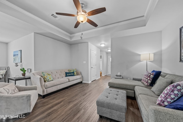 13400 Willow Oak Cir, Gulfport, MS 39503 - living area featuring a raised ceiling, wood finished floors, a ceiling fan, crown molding, and baseboards