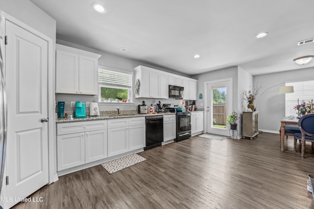 13400 Willow Oak Cir, Gulfport, MS 39503 - kitchen with black appliances, a sink, white cabinetry, recessed lighting, and dark wood finished floors