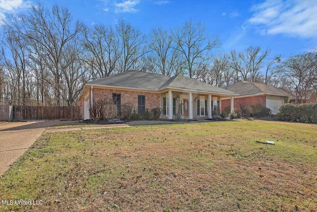 ranch-style house with a porch, a garage, and a front yard