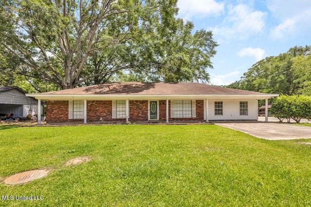 1320 Sally Dr, Picayune, MS 39466 - ranch-style house with a front yard and brick siding
