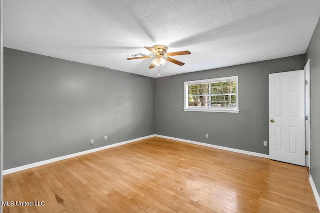 1320 Sally Dr, Picayune, MS 39466 - empty room with a ceiling fan, a textured ceiling, light wood finished floors, and baseboards