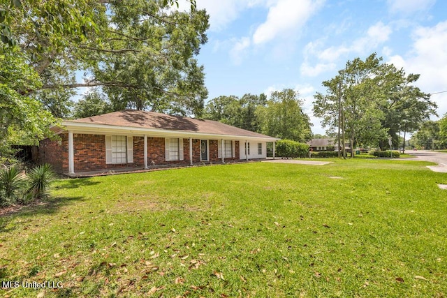 1320 Sally Dr, Picayune, MS 39466 - view of front facade with a front yard and brick siding