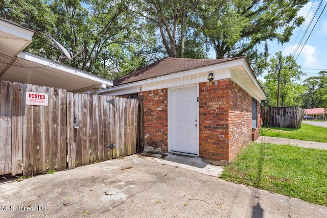 1320 Sally Dr, Picayune, MS 39466 - garage featuring fence and a gate