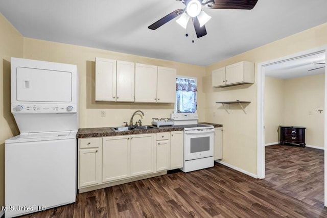 1320 Sally Dr, Picayune, MS 39466 - kitchen with electric stove, a sink, estacked washer and dryer, dark countertops, and dark wood-style flooring