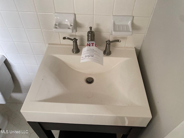 room details featuring vanity and tile patterned flooring