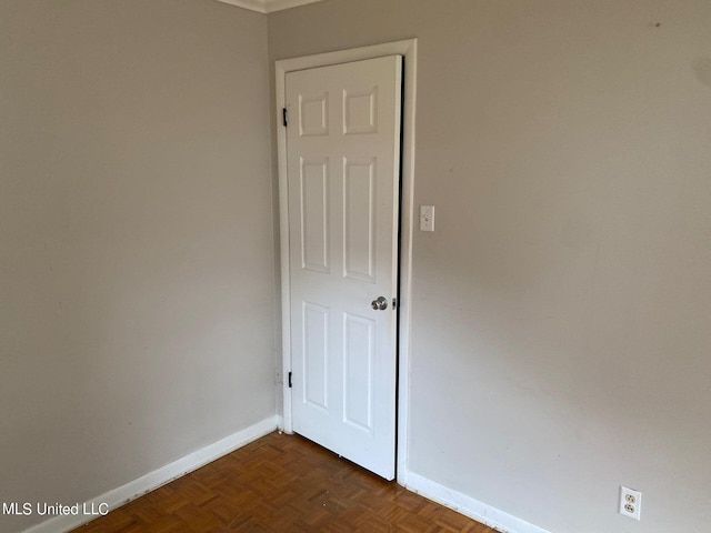 empty room featuring dark parquet floors