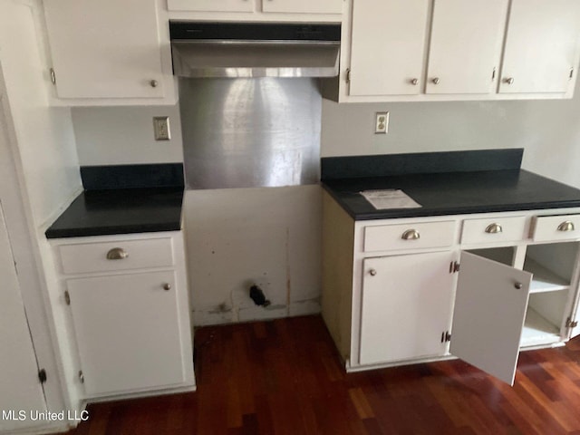 kitchen featuring extractor fan, dark hardwood / wood-style floors, and white cabinets