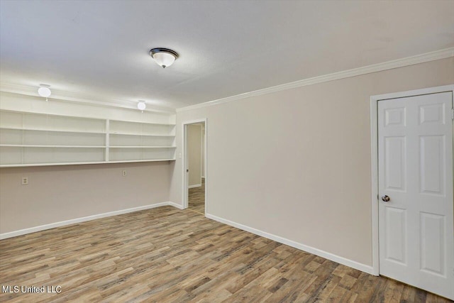 basement with crown molding and wood-type flooring