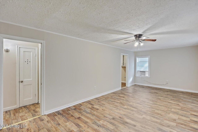 spare room with ceiling fan, a textured ceiling, and light hardwood / wood-style flooring