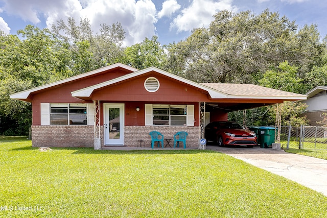 view of front facade featuring a front yard and a carport