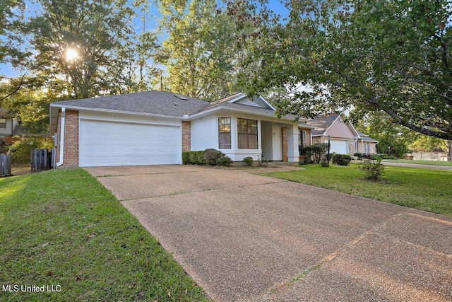 ranch-style house with an attached garage, concrete driveway, brick siding, and a front lawn