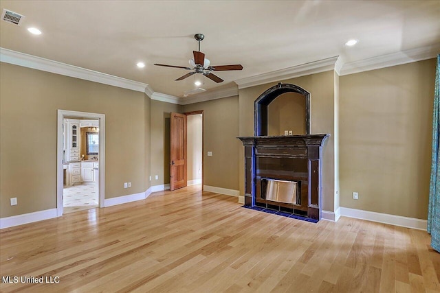 unfurnished living room with ceiling fan, ornamental molding, and light hardwood / wood-style flooring