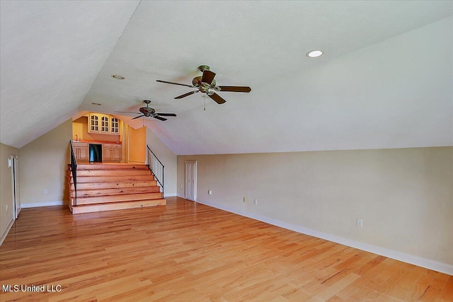 additional living space with ceiling fan, vaulted ceiling, and light hardwood / wood-style floors