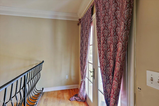 interior space featuring crown molding and hardwood / wood-style flooring