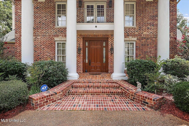 doorway to property featuring a balcony