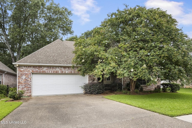 262 Geneva Blvd, Madison, MS 39110 - view of front facade with brick siding, concrete driveway, a shingled roof, a garage, and a front lawn