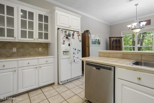 262 Geneva Blvd, Madison, MS 39110 - kitchen with white fridge with ice dispenser, stainless steel dishwasher, a chandelier, decorative backsplash, and glass insert cabinets