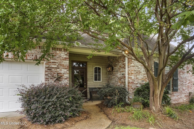 262 Geneva Blvd, Madison, MS 39110 - doorway to property featuring brick siding and roof with shingles