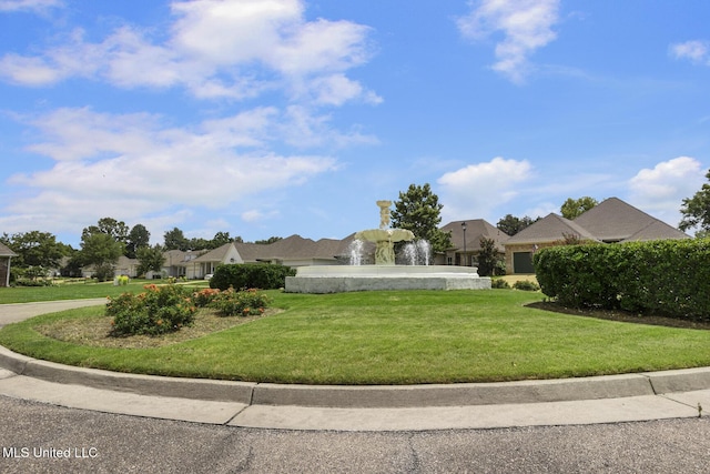 262 Geneva Blvd, Madison, MS 39110 - view of front of home with an attached garage, concrete driveway, a residential view, and a front lawn