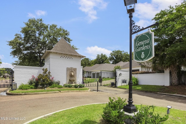 262 Geneva Blvd, Madison, MS 39110 - view of asphalt street featuring curbs, a gate, and a gated entry
