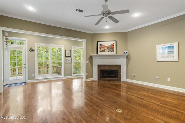 262 Geneva Blvd, Madison, MS 39110 - unfurnished living room with ceiling fan, wood finished floors, a tile fireplace, crown molding, and recessed lighting