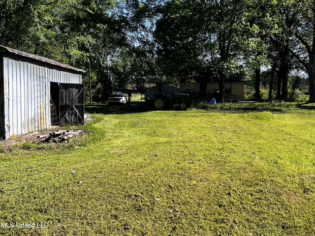 4595 Lucius Taylor Rd, Como, MS 38619 - view of grassy yard with an outdoor structure and a shed