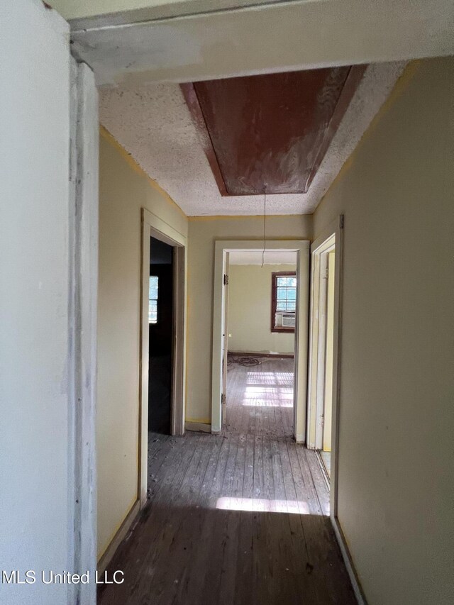 4595 Lucius Taylor Rd, Como, MS 38619 - hallway with attic access, wood-type flooring, and baseboards